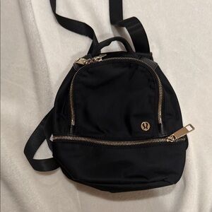 lululemon athletica mini Backpack with Gold Accents or crossbody bag. Like new.